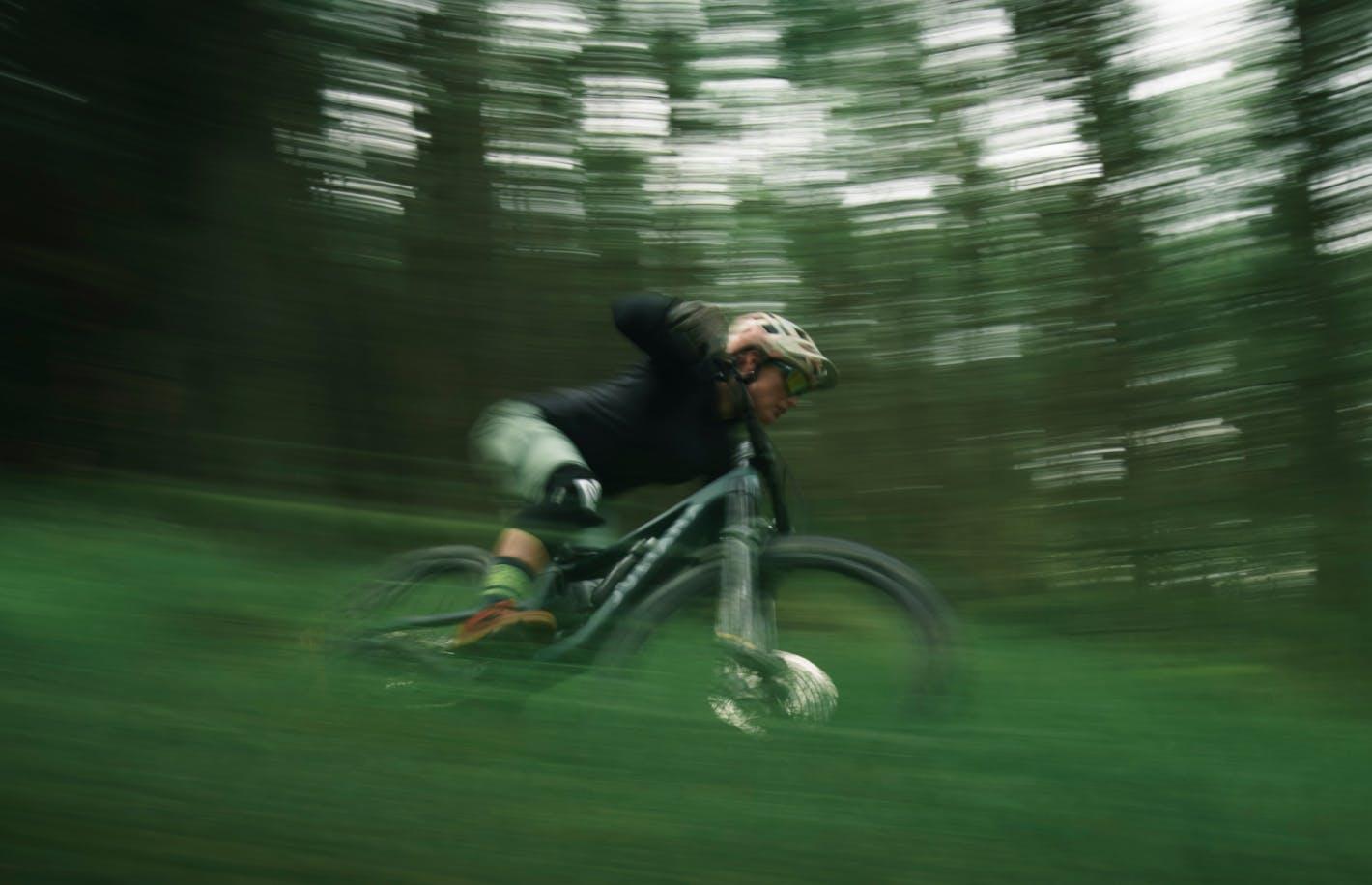 Woman on a bike with green pants