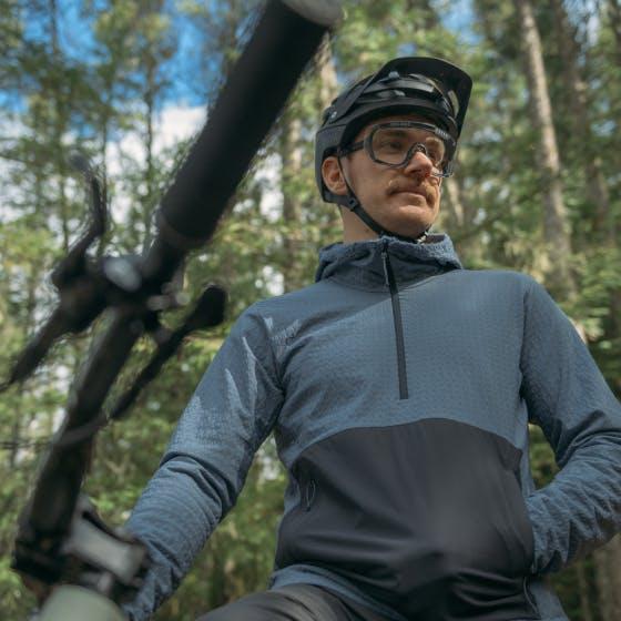 Man on a bike wearing a blue jacket